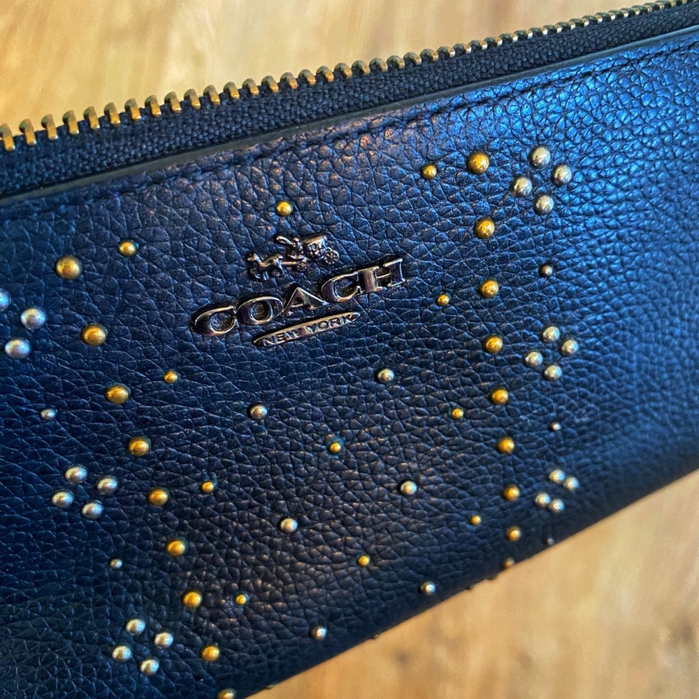 Coach black pebbled women’s wallet. Gorgeous silver and gold metal hardware.